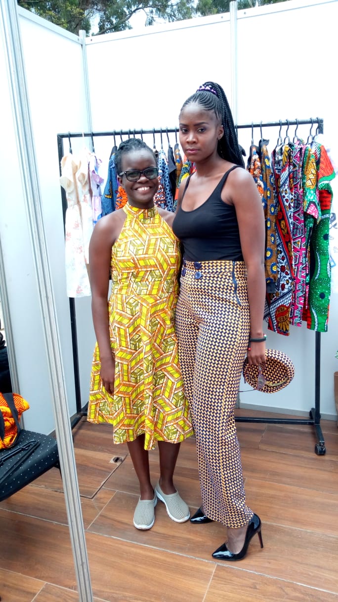 Debbie Oyugi, organizer of the Africa Kids Fashion Week (right) poses for a picture with celebrated fashion designer Shiyenze Khasoha at the event