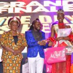 The Self-made President of Hair Africa Mr. Dgohnie Hair Arts (Center) presenting an ward to the crowned Miss Heritage Kenya International