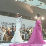 Kenyan International fashion model Eleshia Ais on the runway showcasing wedding gowns by Lotus Glown Bridal