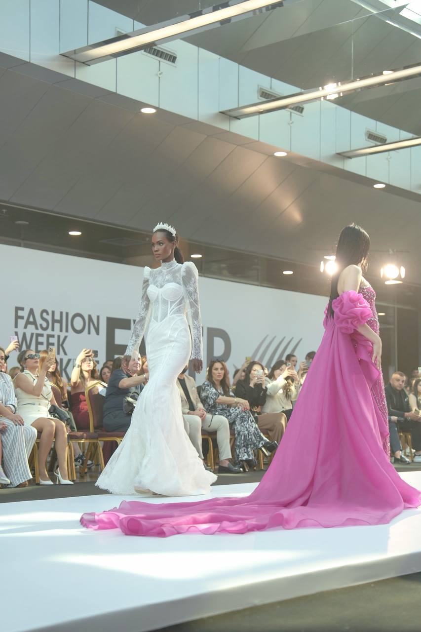 Kenyan International fashion model Eleshia Ais on the runway showcasing wedding gowns by Lotus Glown Bridal